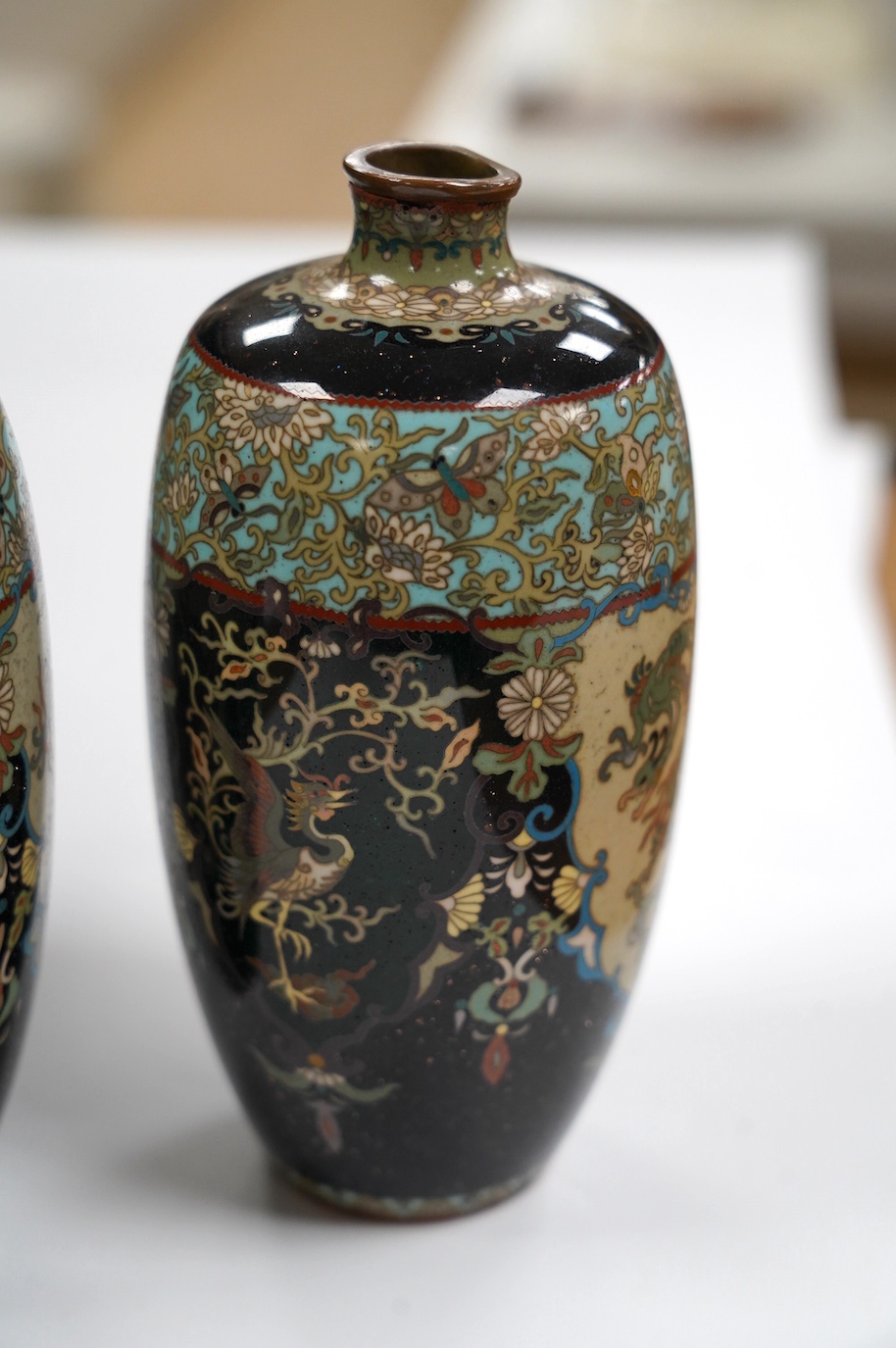 A pair of Japanese cloisonné enamel vases, signed, 14.5cm high. Condition - fair to good